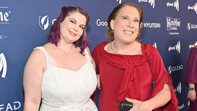 Genevieve Davis and Amy Schneider smile at an event