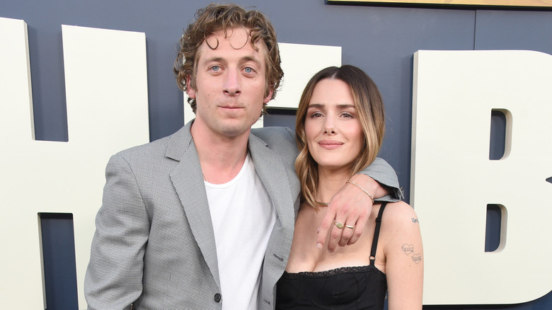 Jeremy Allen White posing and smiling with Addison Timlin