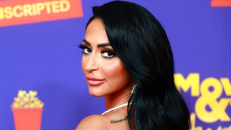 Angelina Pivarnick looking over shoulder