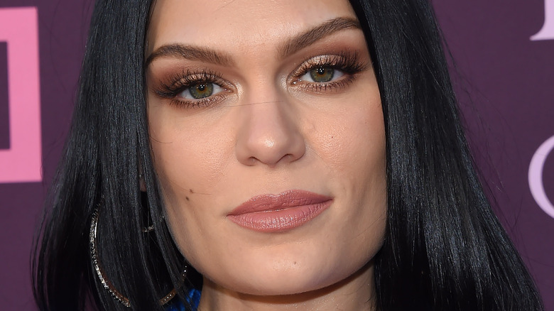 Jessie J poses with silver hoop earrings.