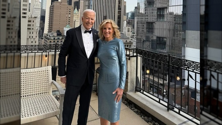 Joe Biden and Jill Biden wearing eveningwear on a balcony