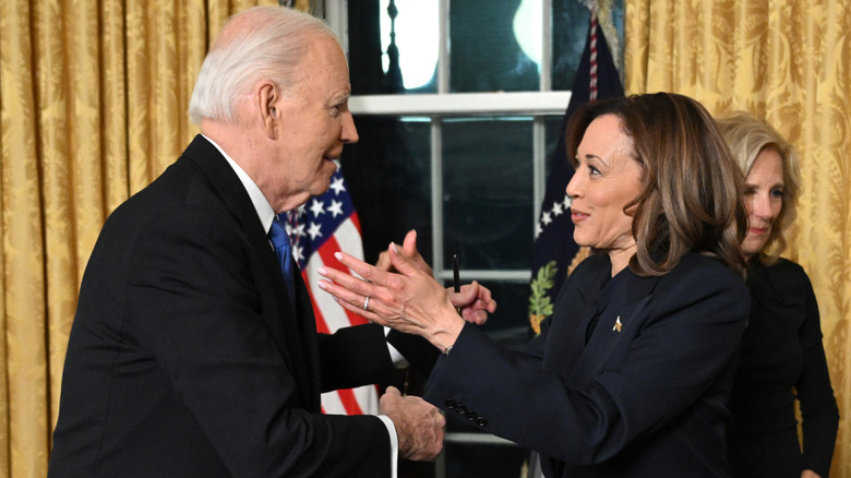 Joe Biden and Kamala Harris going in for a hug.