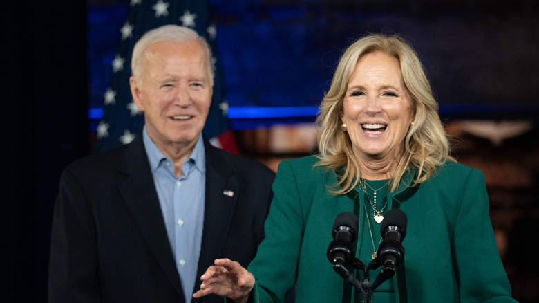 Jill Biden and Joe Biden laughing together on stage