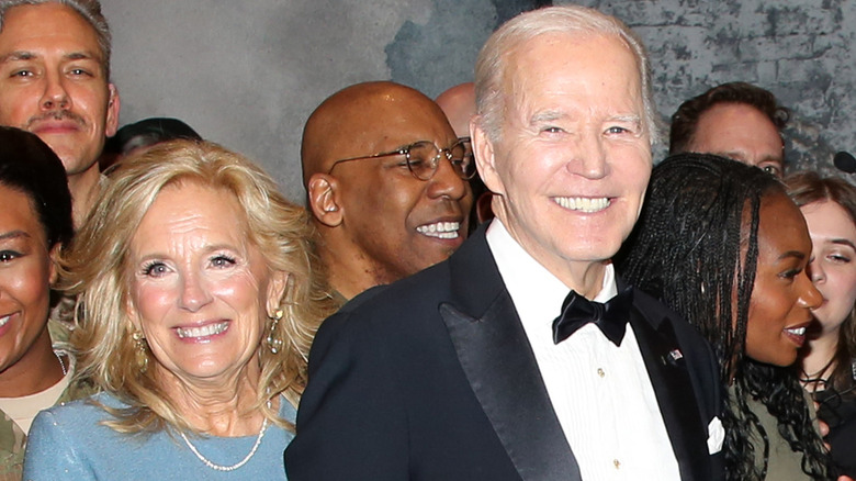 Jill Biden standing behind Joe Biden