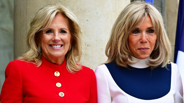 Jill Biden posing alongside Brigitte Macron.