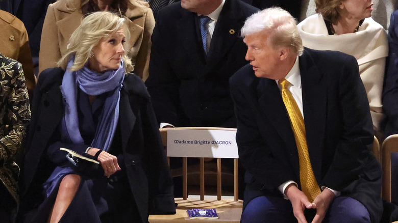 Donald Trump talking to an unimpressed looking Jill Biden