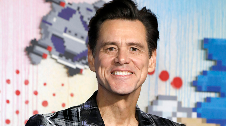 Jim Carrey smiles on the red carpet in 2020 