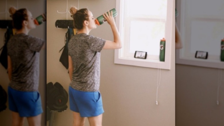 Jinger Duggar wearing blue shorts