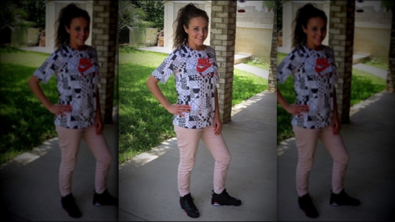Jinger Duggar wearing Nike shirt and pink jeans