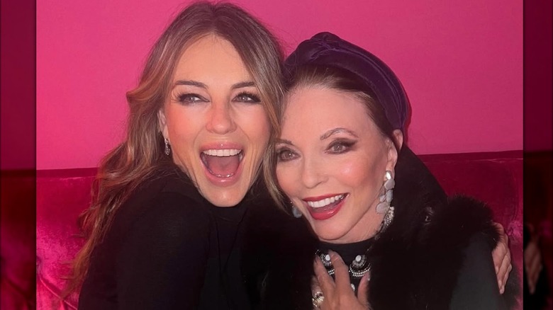 Elizabeth Hurley smiling with Joan Collins