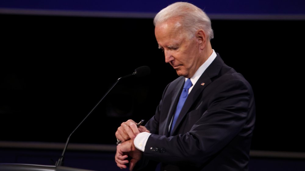 Joe Biden looking at watch during presidential debate