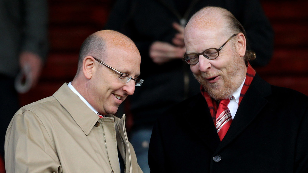 Brothers Joel and Avram Glazer share a laugh