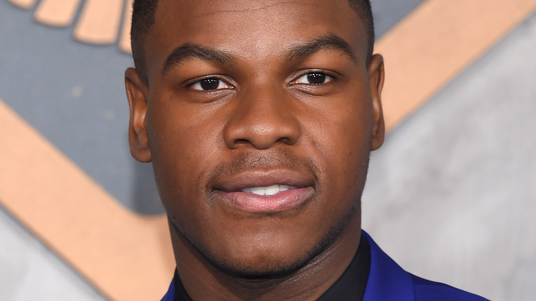 John Boyega smirking