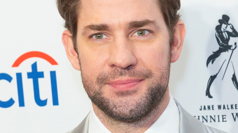 John Krasinski posing on red carpet