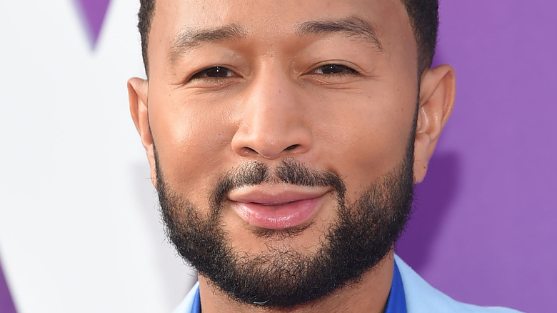 John Legend on a red carpet