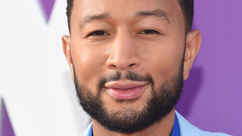 John Legend smiles for photo 