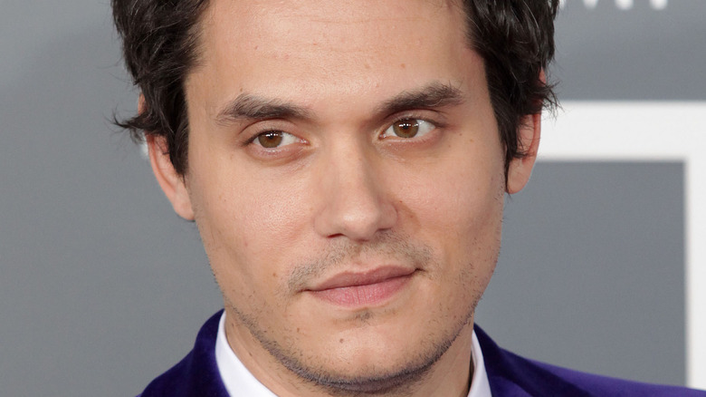 John Mayer smiling slightly