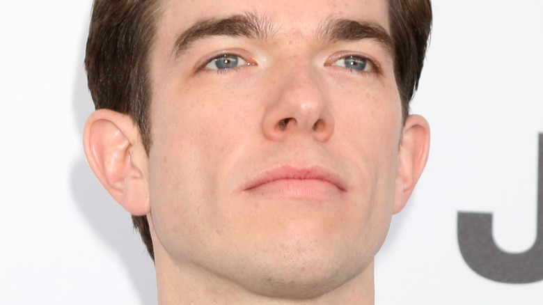 John Mulaney posing