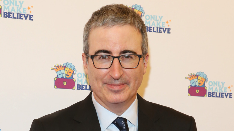 John Oliver posing in 2022