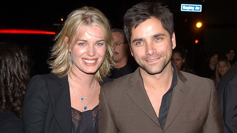 Rebecca Romijn, John Stamos smiling