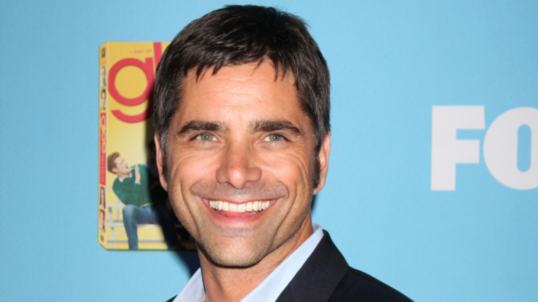 John Stamos grinning