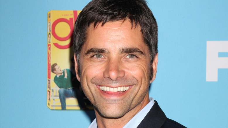 John Stamos grinning