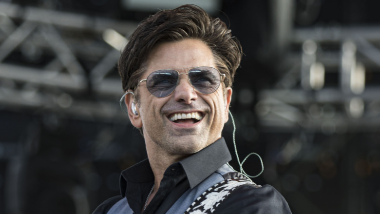 John Stamos performing 