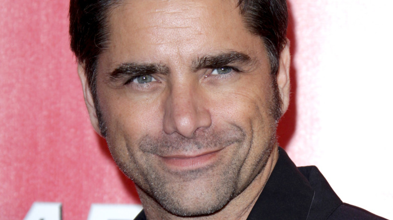 John Stamos smiles for the cameras