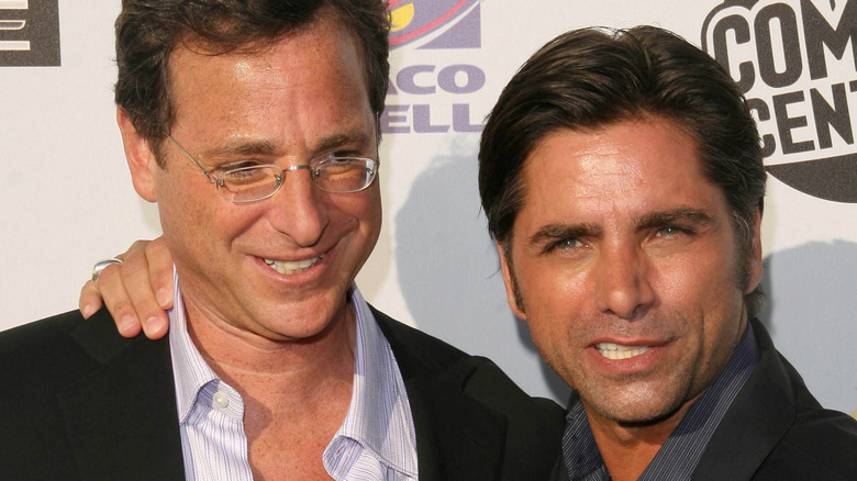 Bob Saget smiling at John Stamos