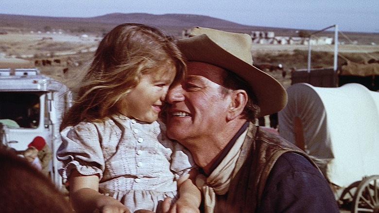 John Wayne with Aissa Wayne on the set of 