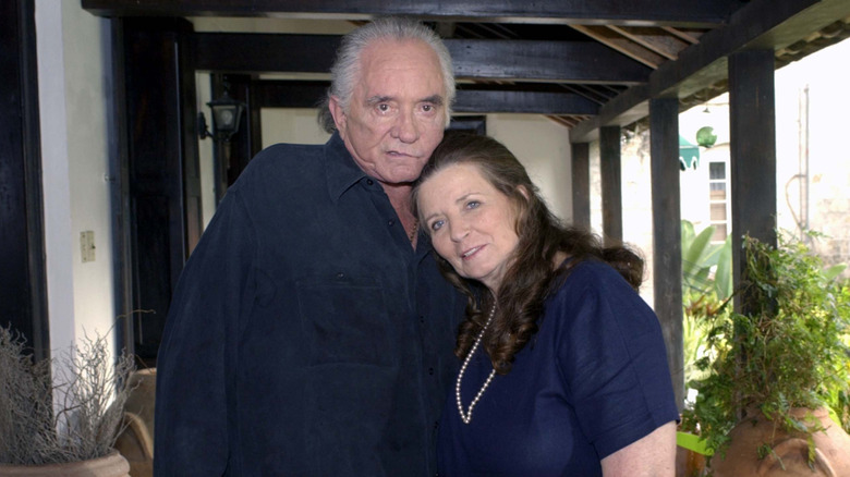 Johnny Cash and June Carter Cash posing together.