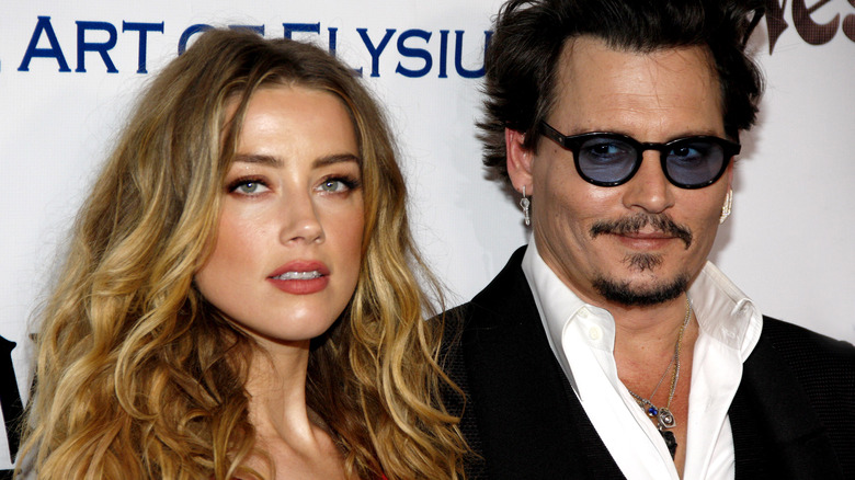 Amber Heard, Johnny Depp posing