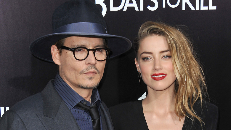 Johnny Depp and Amber Heard attend the premiere of "3 Days to Kill"