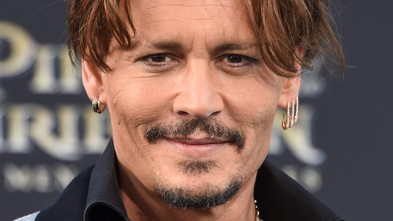 Johnny Depp smiling at red carpet event
