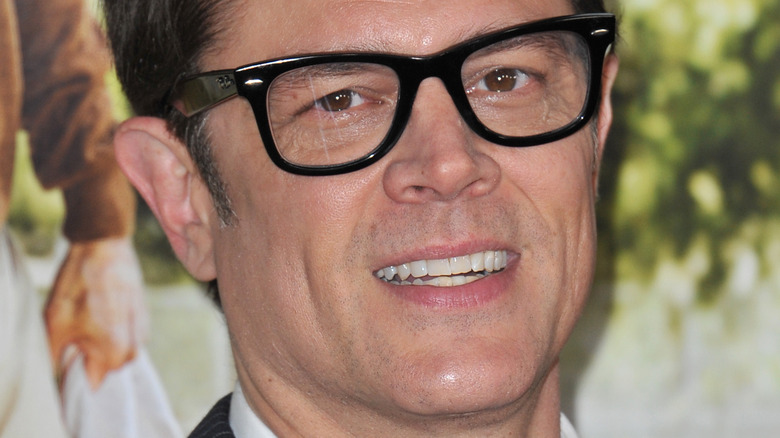 Johnny Knoxville smiling in glasses