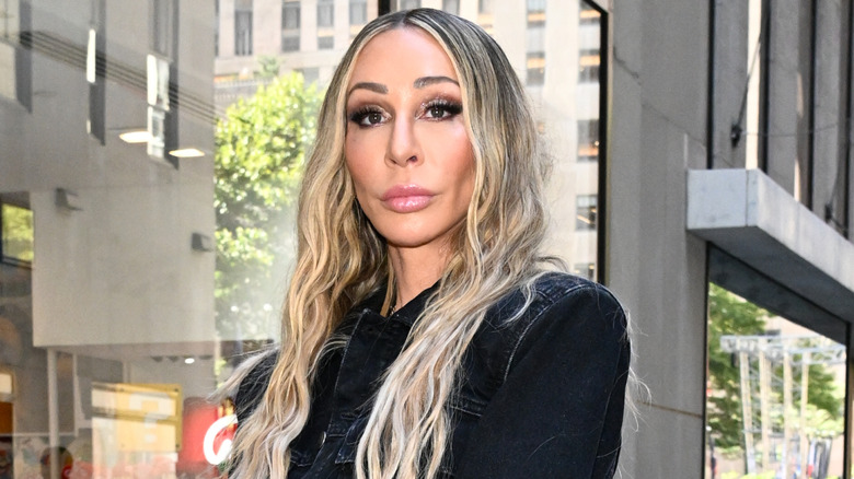 Hailey Glassman poses outside a building in September 2026