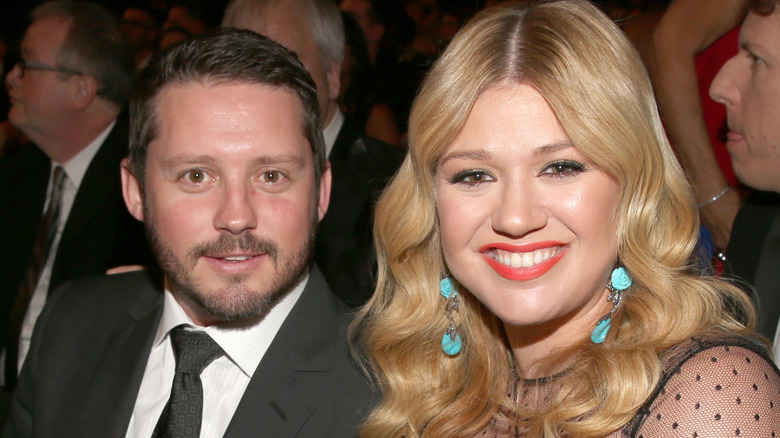 Brandon Blackstock and Kelly Clarkson posing for a photo