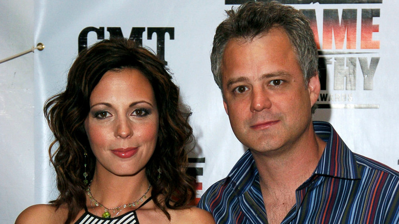 Sara Evans and Craig Schelske posing for a photo