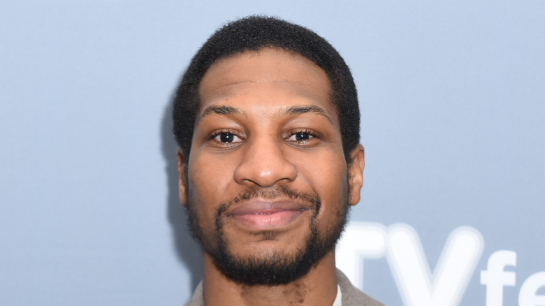 Jonathan Majors smiling