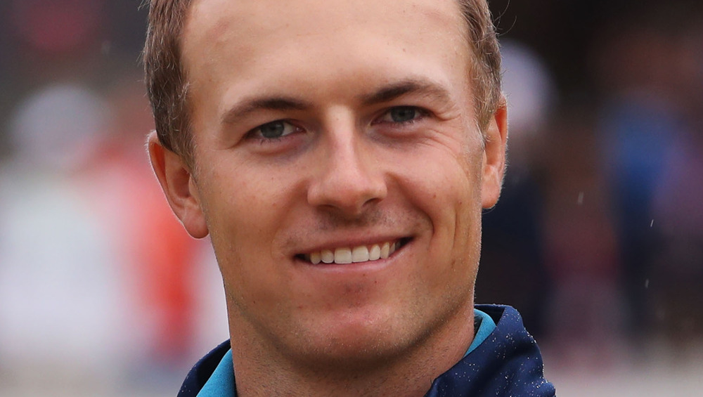 Jordan Spieth smiling at a golfing event