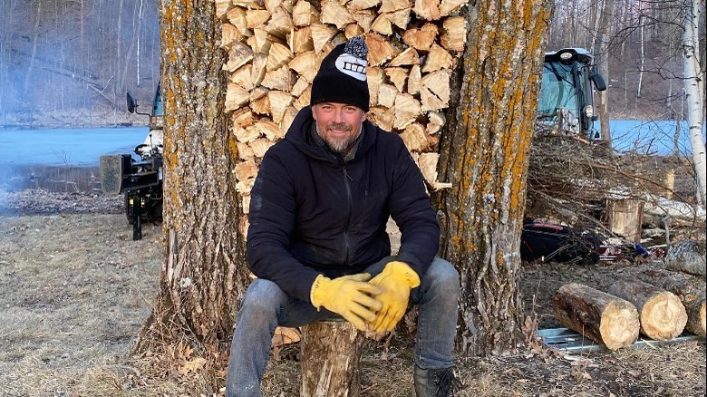 Josh Duhamel and stack of logs
