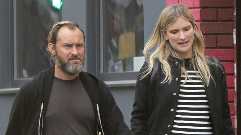 Jude Law walking with Phillipa Coan