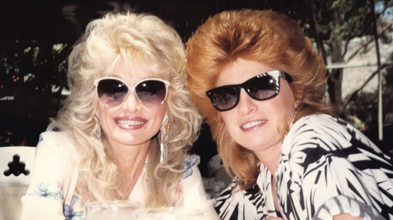 Throwback pic of Dolly Parton and Judy Ogle wearing sunglasses.