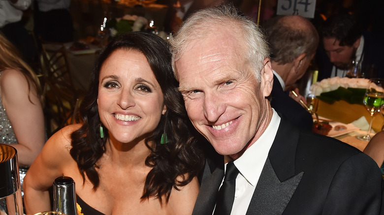 Julia Louis-Dreyfus and Brad Hall smile together