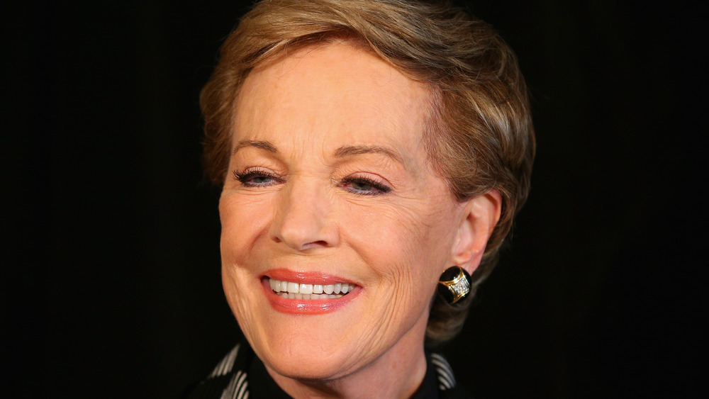 Julie Andrews smiles for the camera at an event