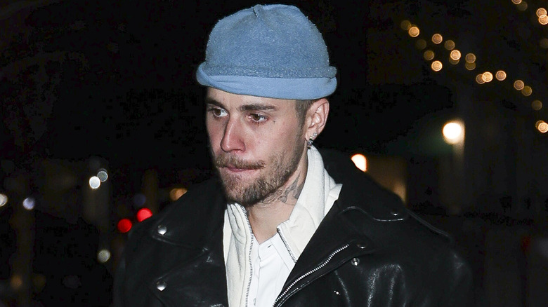 Justin Bieber in a blue hat and leather jacket on The Upper East Side of New York