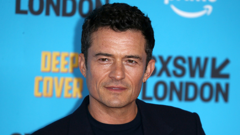 Orlando Bloom posing seriously at Deep Cover World Premiere