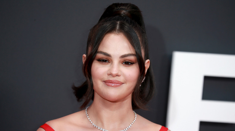 Selena Gomez smiling with long bangs
