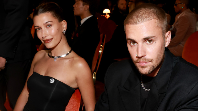 Justin and Hailey Bieber sitting together at the 2026 Grammys while all in black