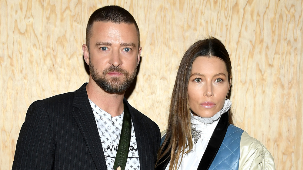 Justin Timberlake & Jessica Biel pose for a picture at Paris Fashion Week